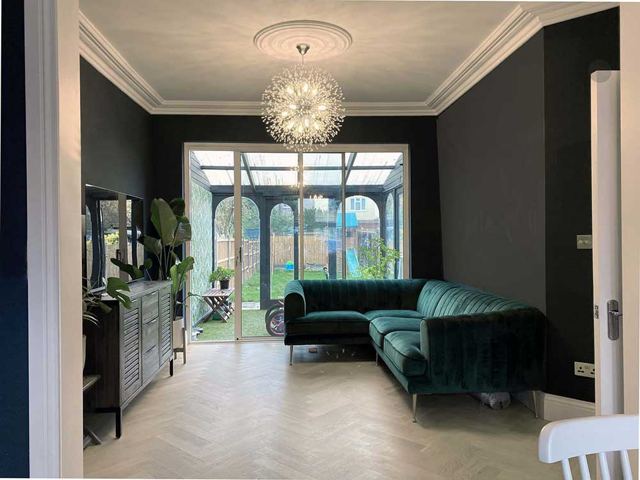 Green living room with herringbone floor – Star Design Solutions