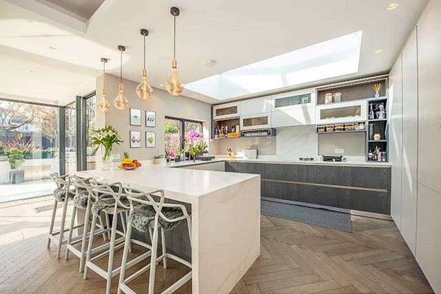 Kitchen extension with island and roof lantern designed by Star Design Solutions
