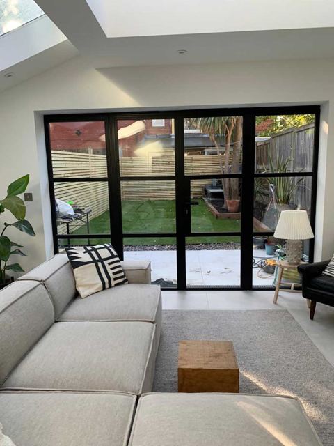 Living room with Crittall-style garden doors – Star Design Solutions