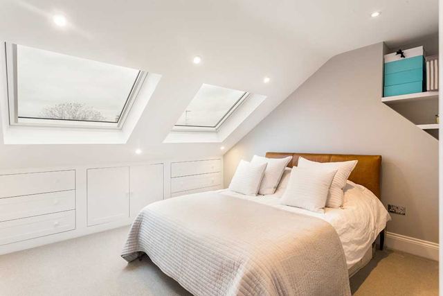 Loft conversion bedroom with Velux windows