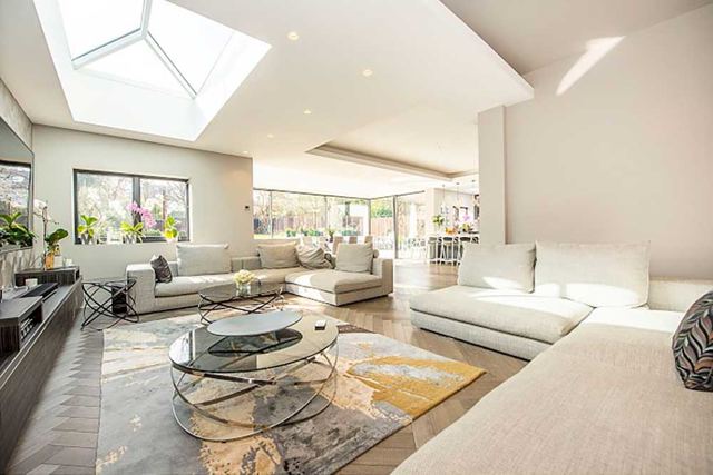Open-plan lounge under a roof lantern – Star Design Solutions
